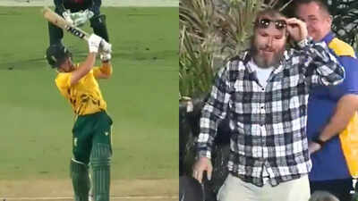 Watch: Ouch! Fan crashes into the fence while trying to catch a massive Dewald Brevis six during AUS vs SA 3rd T20I | Cricket News