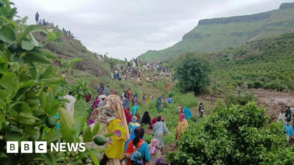A collapsing mountain and bodies still buried under rubble in Darfur