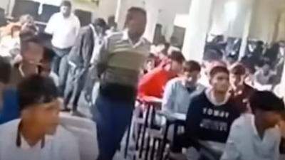 Bihar Class 10 exams marred by chaos: Viral clip shows students scaling walls, using chits & phones, live streaming on FB | Patna News