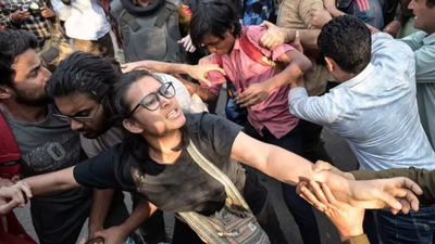 Jnu Students Protest: ‘Pelted banners and sticks, threw shoes’: Students break JNU gate lock; march to ministry foiled, several detained | Delhi News